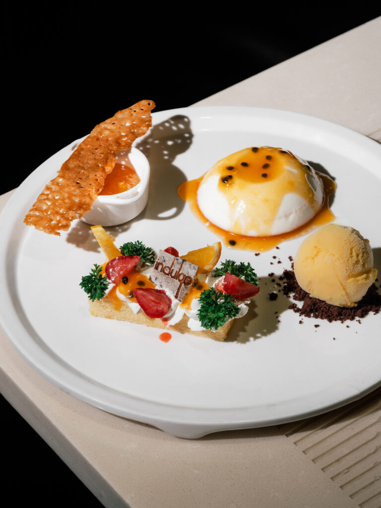 Passionate Vanilla mango and passion fruit panna cotta with coconut and mango sorbet
