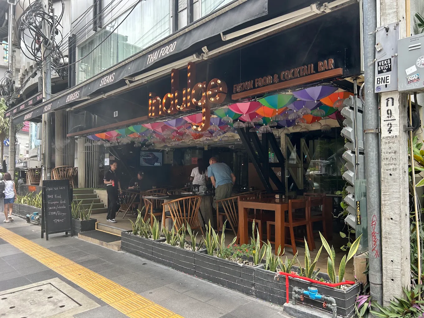 Group dining experience at Indulge restaurant in Bangkok.